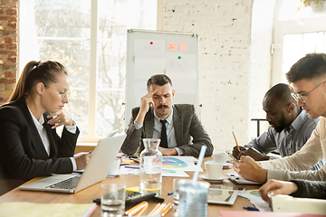 Image showing Group of young business professionals having a meeting, creative office