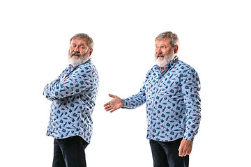 Image showing Senior man arguing with himself on white studio background.