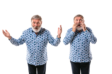 Image showing Senior man arguing with himself on white studio background.