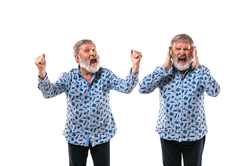 Image showing Senior man arguing with himself on white studio background.