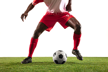 Image showing Professional african football or soccer player isolated on white background