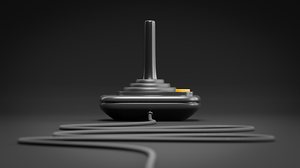 Image showing black retro joystick with orange button