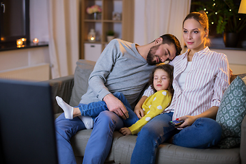 Image showing tired sleepy family watching tv at home at night
