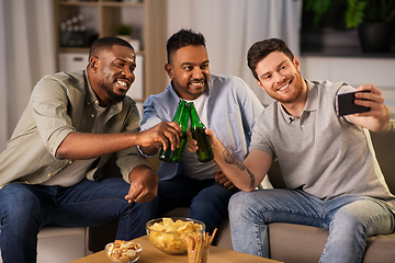 Image showing male friends with smartphone taking selfie at home