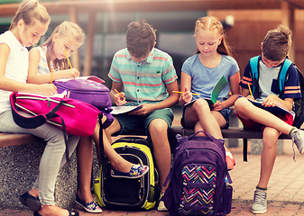 Image showing group of happy elementary school students outdoors