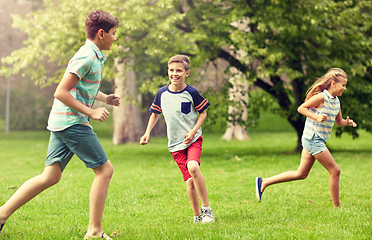 Image showing happy kids running and playing game outdoors