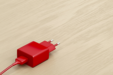 Image showing Red smartphone charger