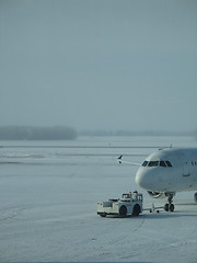Image showing towed airplane in the winter