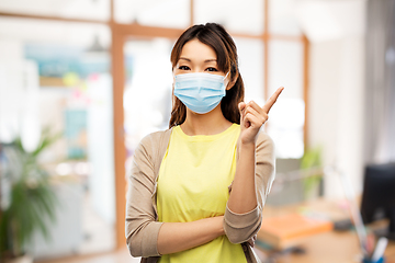 Image showing asian young woman in protective medical mask