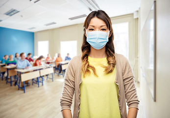 Image showing asian young woman in protective medical mask