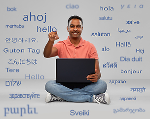 Image showing happy indian man with laptop learning languages