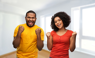 Image showing happy african american couple celebrating success