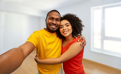 Image showing happy smiling african american couple takes selfie