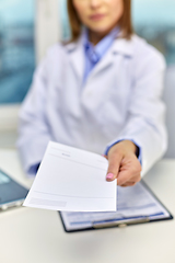 Image showing close up of doctor with prescription at hospital