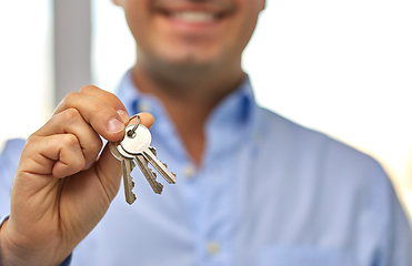 Image showing close up of smiling man holding house keys