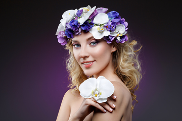 Image showing beautiful blond girl with flowers