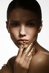 Image showing girl with golden paint on fingers