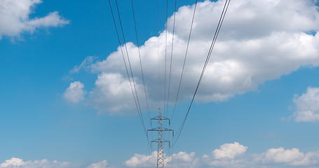 Image showing cloudy morning sky and a high-voltage line