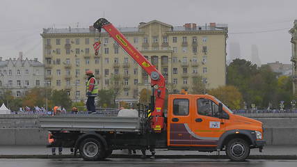 Image showing MOSCOW - OCTOBER 14: Workers load the fence into the truck on October 14, 2017 in Moscow, Russia