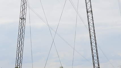 Image showing Cloudy morning sky and a high-voltage line