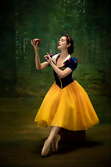 Image showing Young ballet dancer as a Snow White with poisoned apple in forest