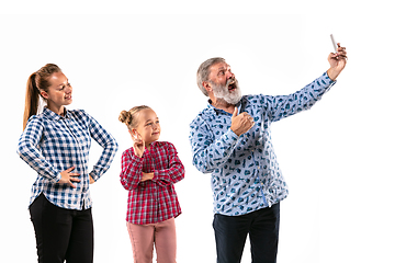 Image showing Happy family with child looks happy together on white background