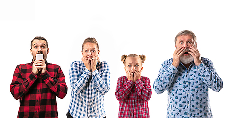 Image showing Family members with one another on white studio background.