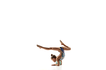 Image showing Little flexible female gymnast isolated on white studio background