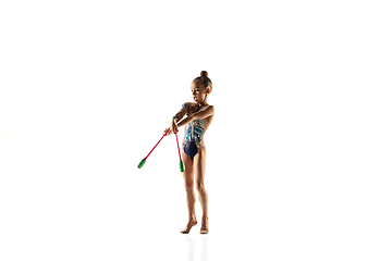 Image showing Little flexible female gymnast isolated on white studio background