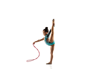 Image showing Little flexible female gymnast isolated on white studio background