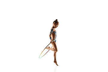 Image showing Little flexible female gymnast isolated on white studio background
