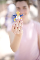 Image showing woman holding pacifier