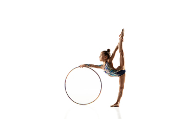 Image showing Little flexible female gymnast isolated on white studio background