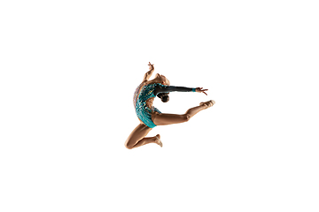 Image showing Little flexible female gymnast isolated on white studio background