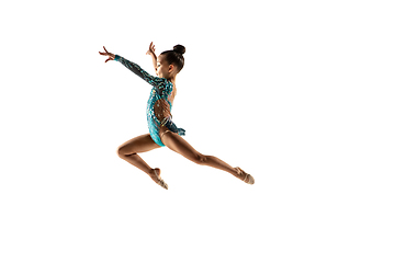 Image showing Little flexible female gymnast isolated on white studio background