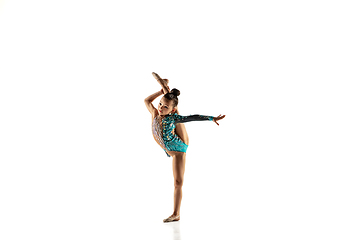 Image showing Little flexible female gymnast isolated on white studio background