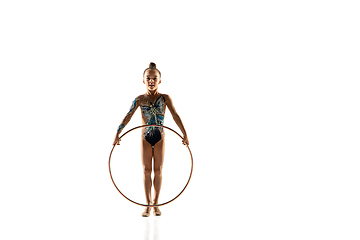 Image showing Little flexible female gymnast isolated on white studio background