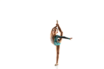 Image showing Little flexible female gymnast isolated on white studio background