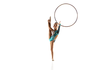 Image showing Little flexible female gymnast isolated on white studio background