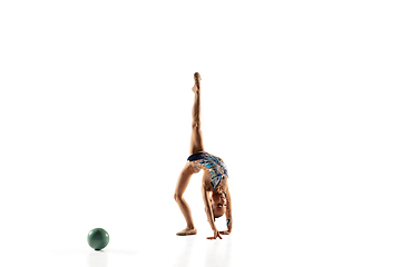 Image showing Little flexible female gymnast isolated on white studio background