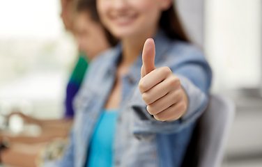 Image showing close up of happy student girl showing thumbs up