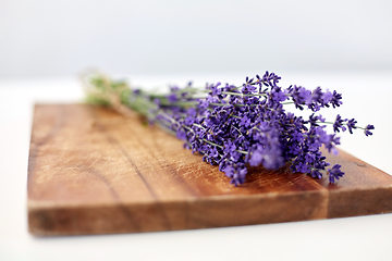 Image showing bunch of lavender flowers on wooden board