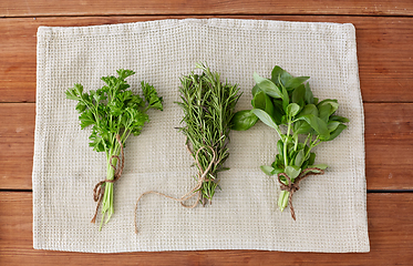 Image showing greens, spices or medicinal herbs on towel