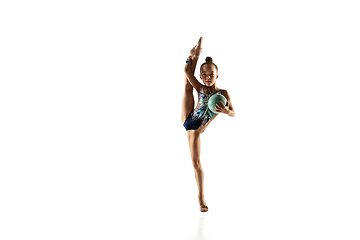 Image showing Little flexible female gymnast isolated on white studio background