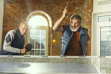 Image showing Senior men playing table tennis in workplace, having fun