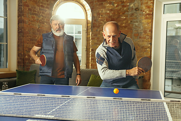 Image showing Senior men playing table tennis in workplace, having fun