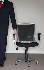 Image showing Businessman leading Chair; 