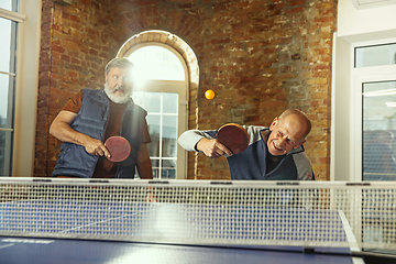 Image showing Senior men playing table tennis in workplace, having fun