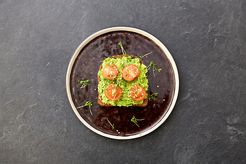 Image showing toast bread with mashed avocado and cherry tomato