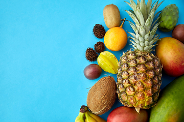 Image showing many different exotic fruits on blue background